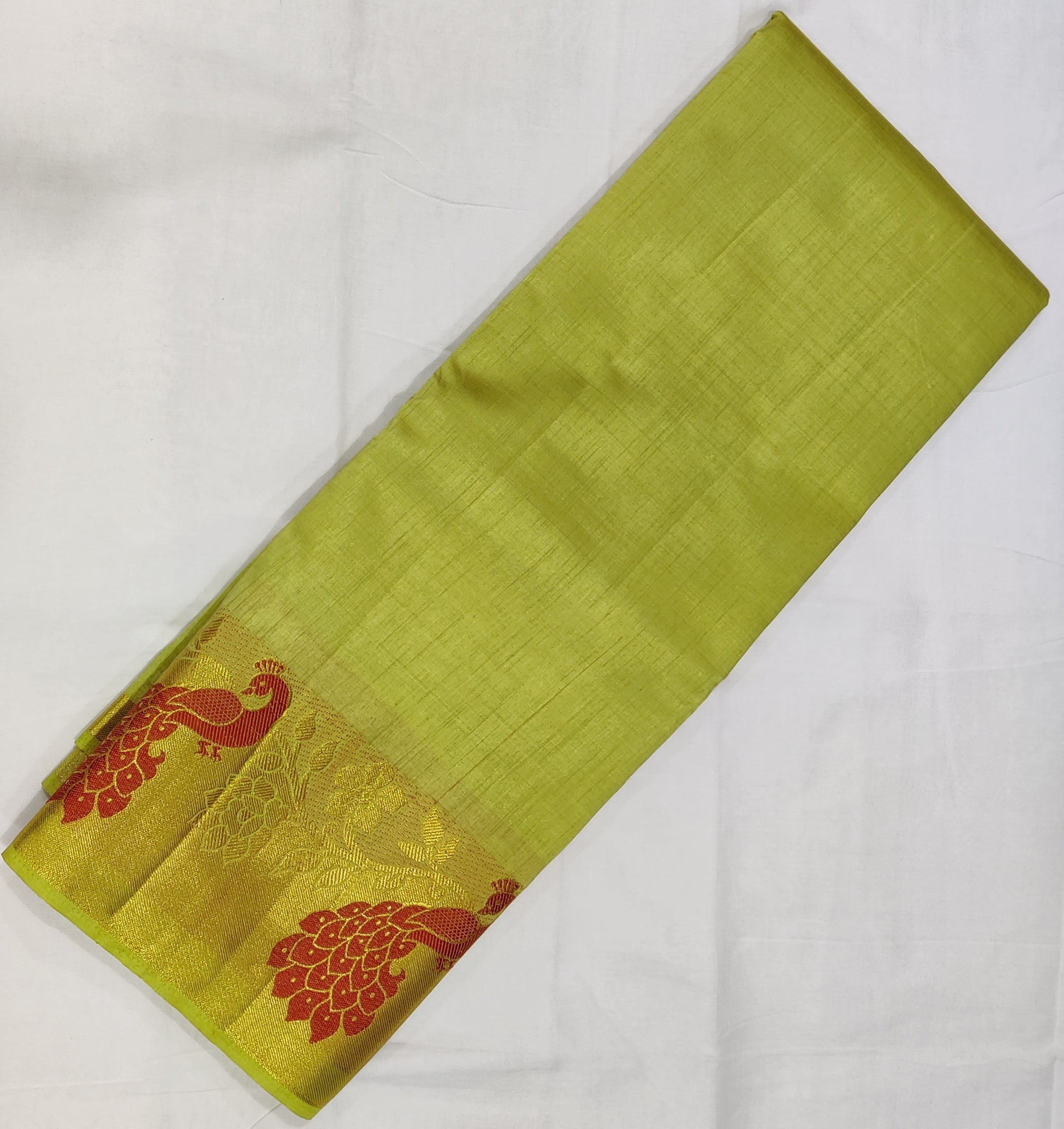 33371 Semi Raw Silk Saree with Big Peacock embossed Zari Border and Pista Green Body Color