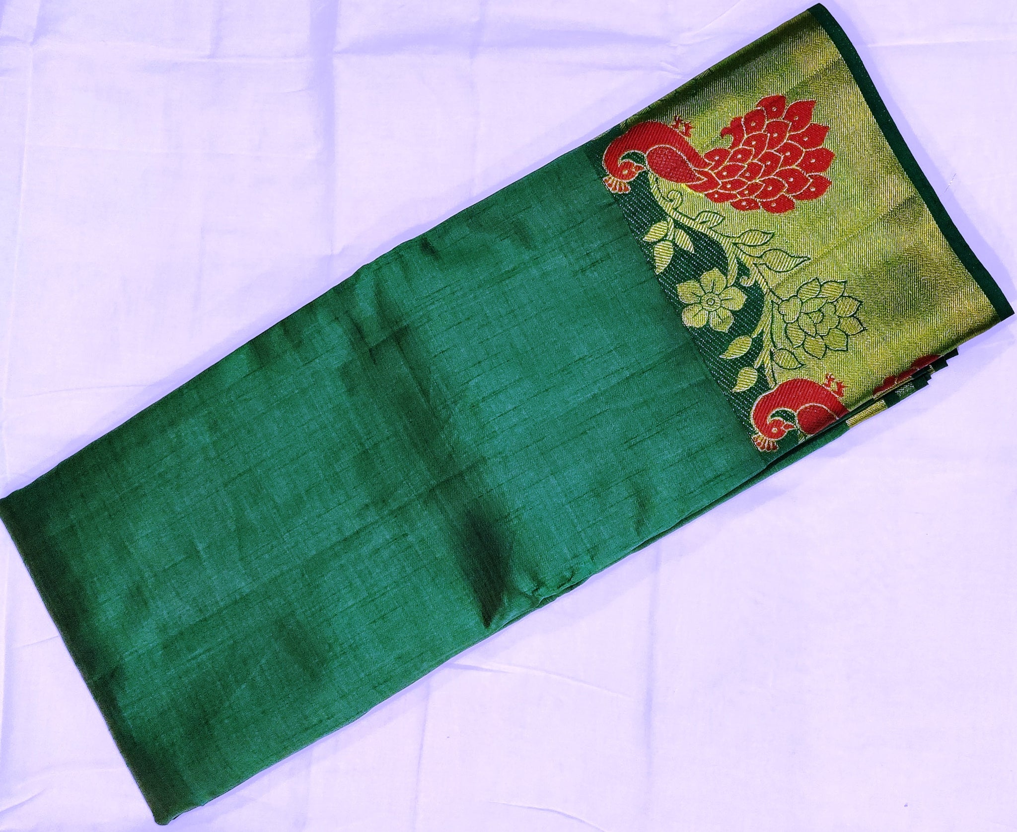 33369 Semi Raw Silk Saree with Big Peacock embossed Zari Border and Dark Green Body Color